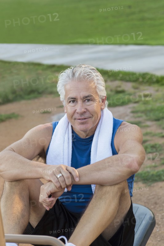 Hispanic man exercising in park