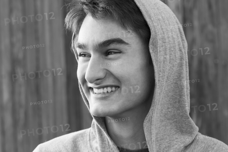 Mixed race teenage boy smiling