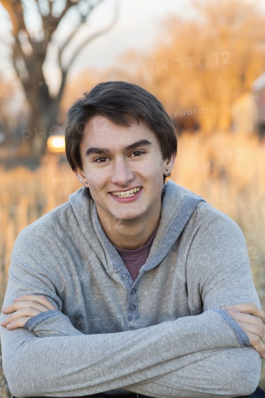 Mixed race teenage boy smiling