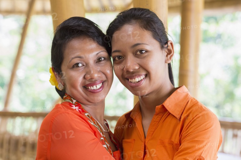 Balinese mother and daughter hugging
