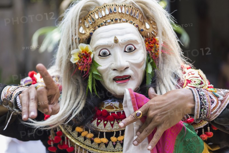 Balinese performer wearing mask and costume