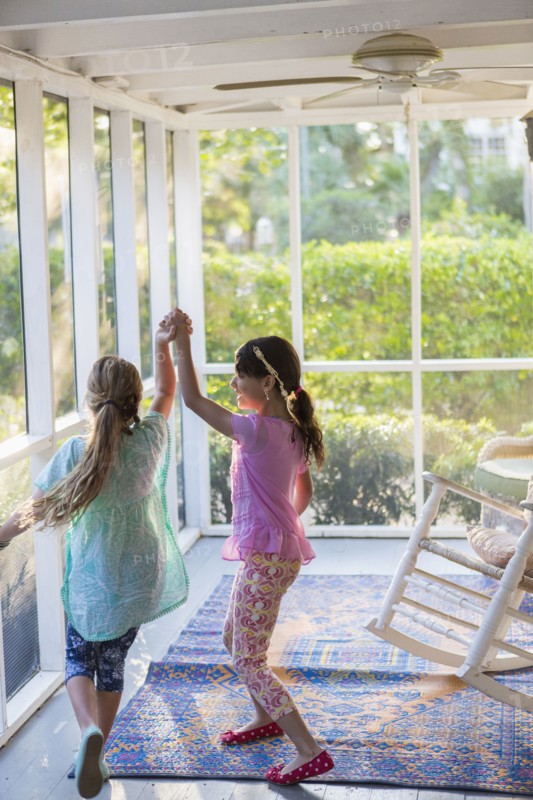 Girls playing together on porch