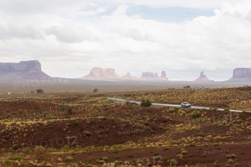 Rock formations and remote road in desert landscape