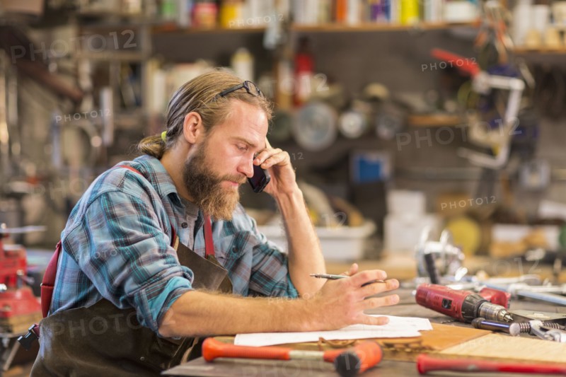 Caucasian craftsman working in workshop