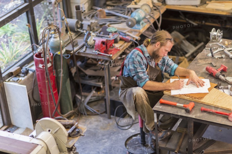 Caucasian craftsman working in workshop