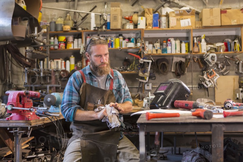 Caucasian craftsman working in workshop