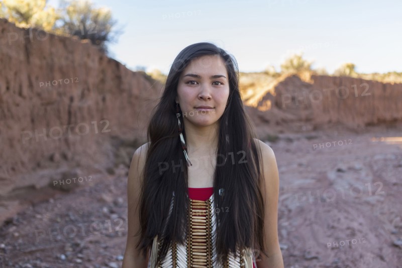 Mixed race woman standing in remote desert landscape