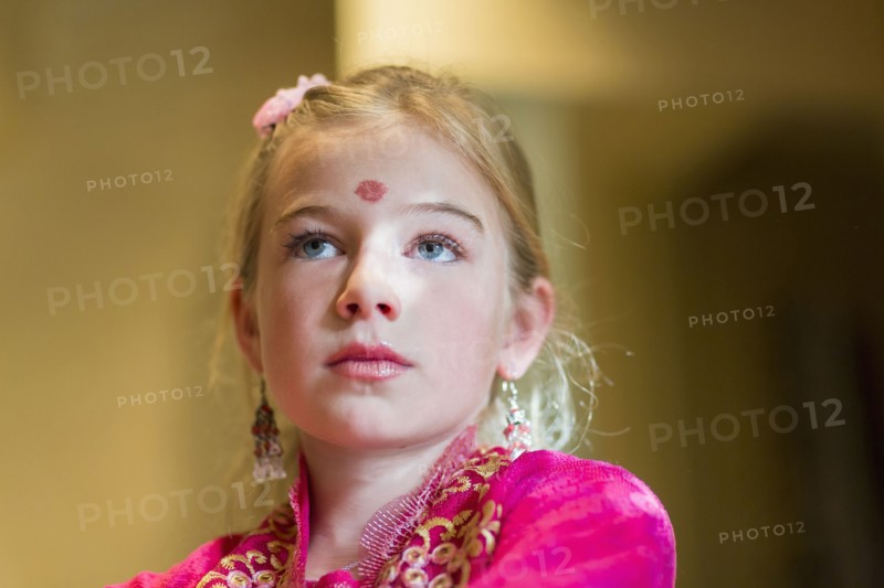 Caucasian girl wearing bindi on forehead