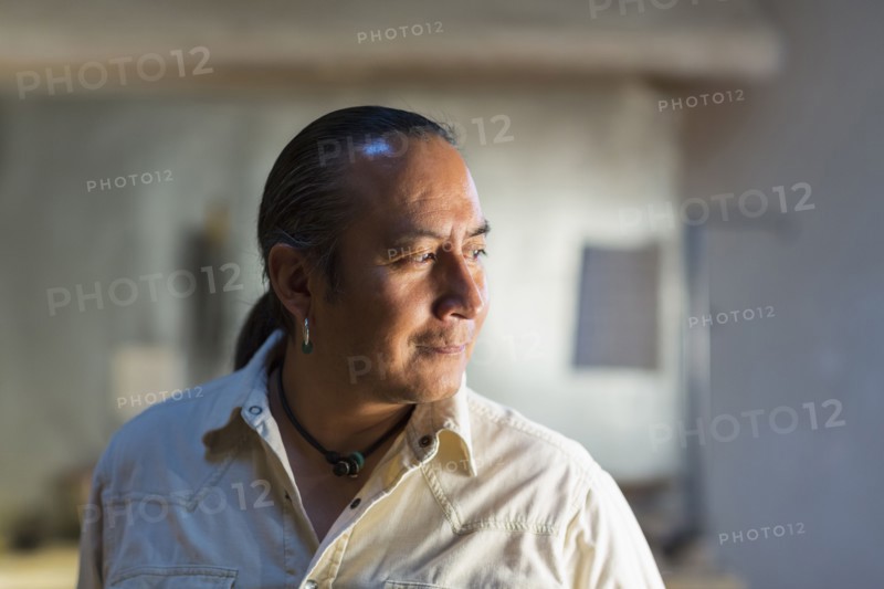 Native American man smiling indoors