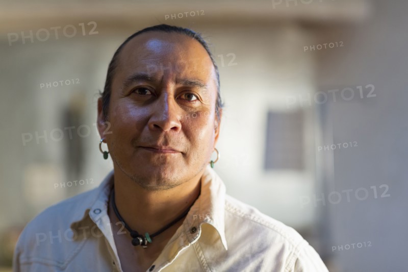 Native American man smiling indoors