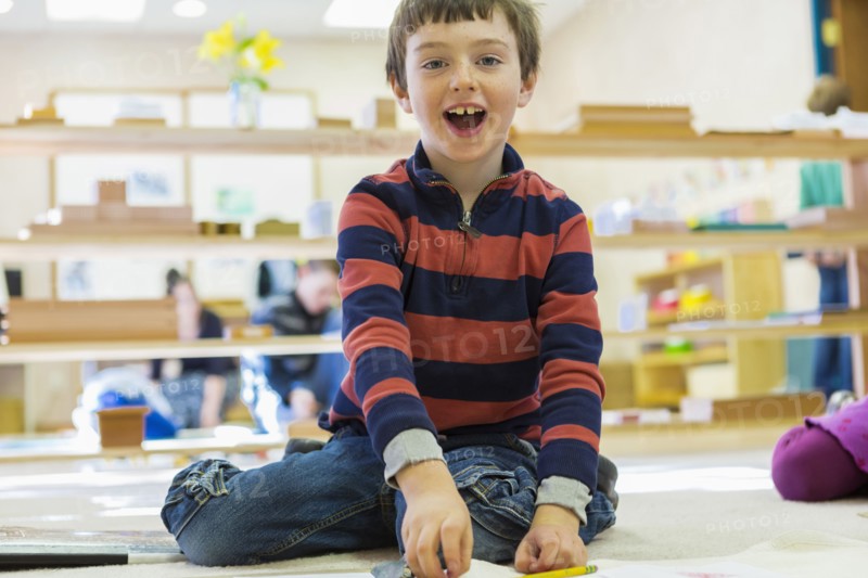 Caucasian boy playing in classroom