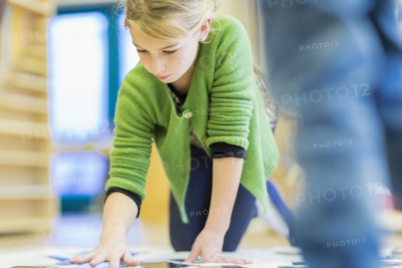 Caucasian girl working in classroom
