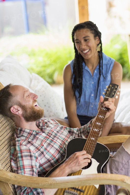 Couple playing music in backyard