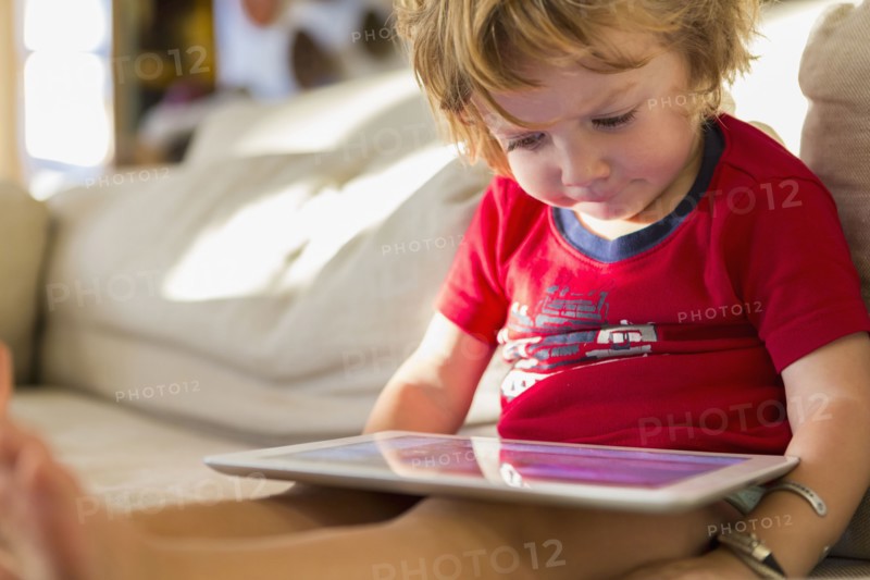 Caucasian boy using digital tablet