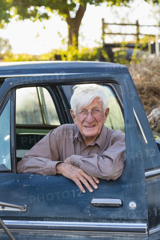 Older Caucasian man sitting in truck