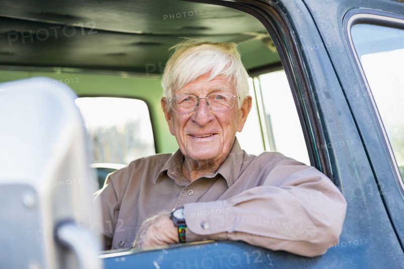 Older Caucasian man sitting in truck