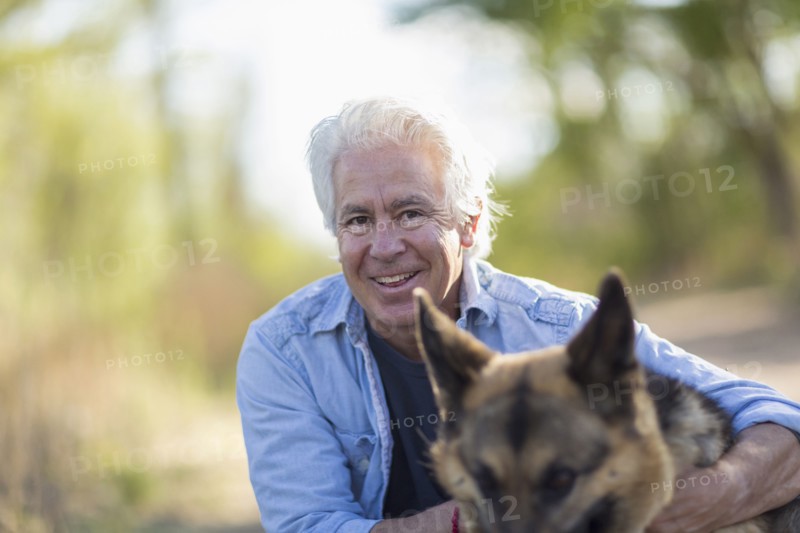 Caucasian man petting dog