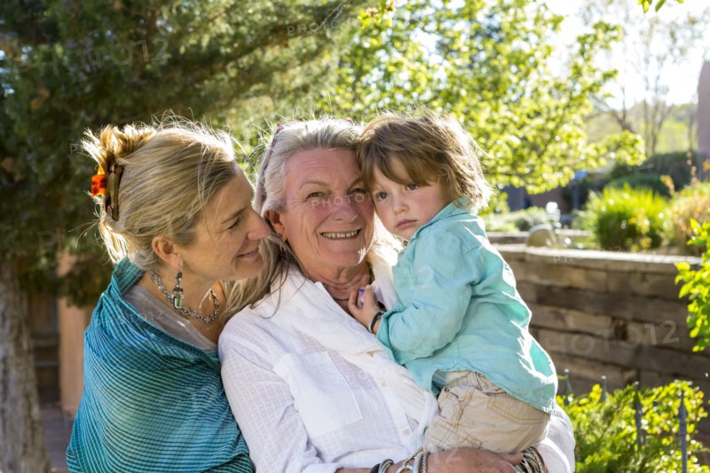 Smiling Caucasian multi-generation family posing outdoors