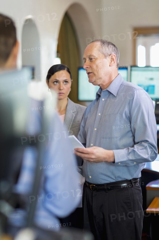 Caucasian business people talking in office