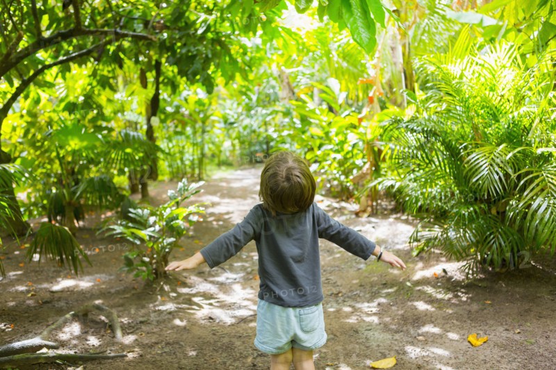 Carefree Caucasian boy standing on path