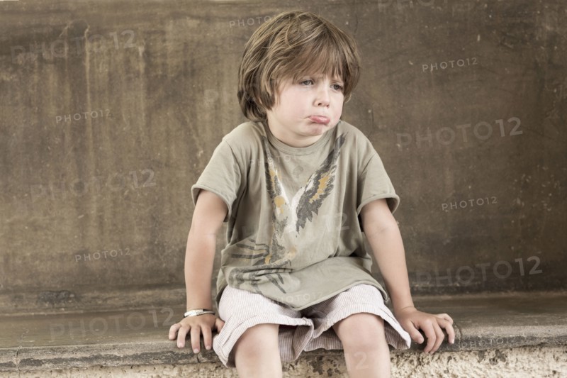 Pouting Caucasian boy