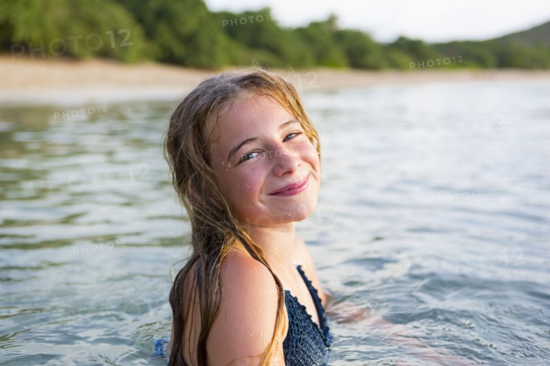Portrait of smiling Caucasian girl swimming