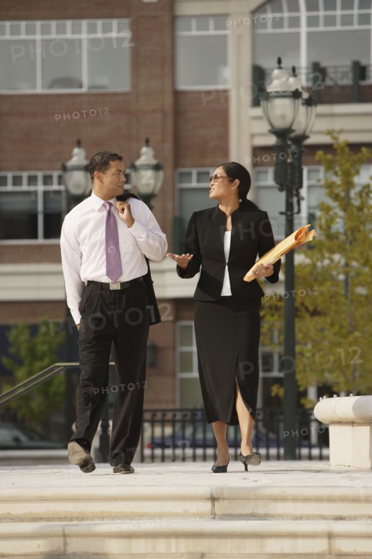 Multi-ethnic businesspeople talking outdoors