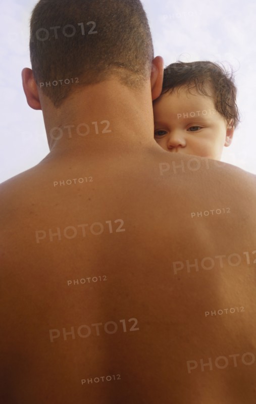 Mixed Race father holding baby