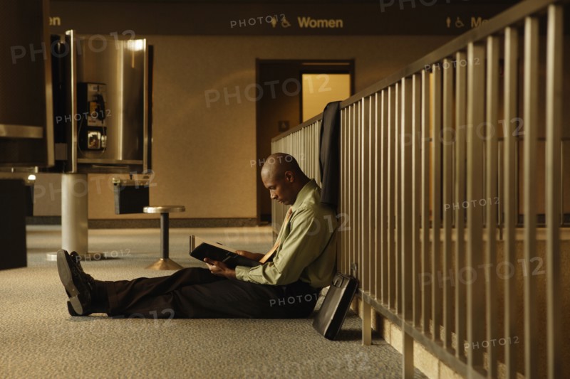 African businessman reading book