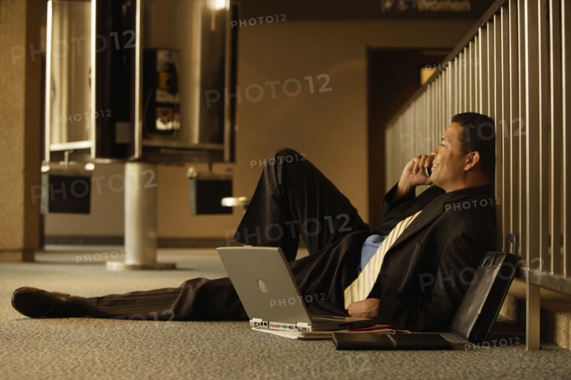 Hispanic businessman talking on cell phone