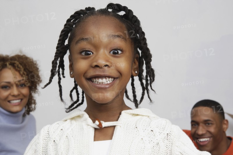 African girl in front of parents