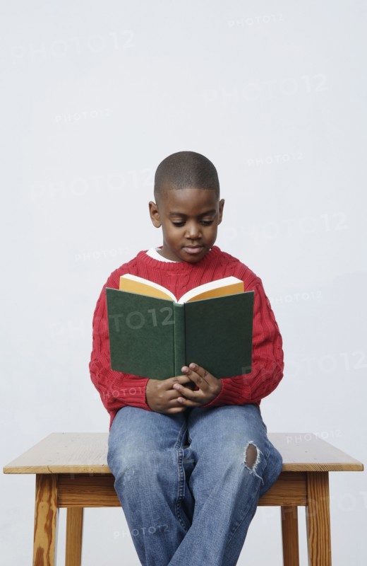 African boy reading book