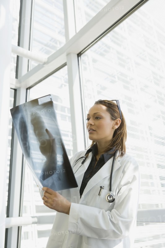 African doctor reviewing x-ray
