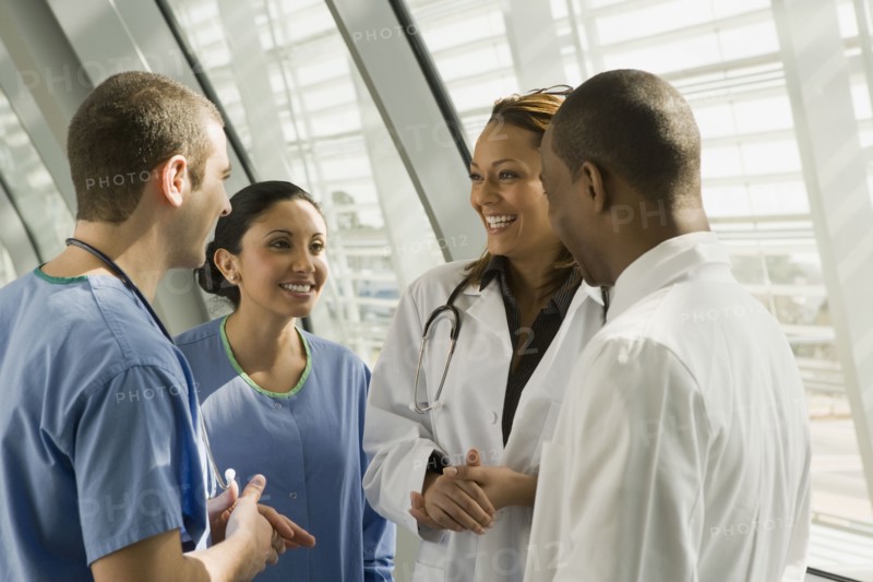 Multi-ethnic doctors and nurses talking
