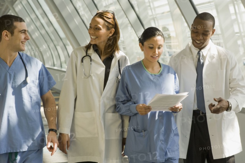 Multi-ethnic doctors and nurses in corridor