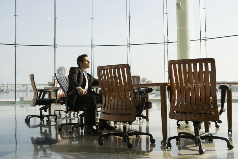 Businessman waiting in conference room for meeting