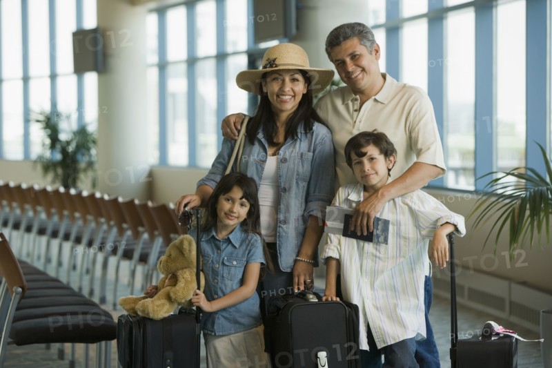 Hispanic family waiting in airport