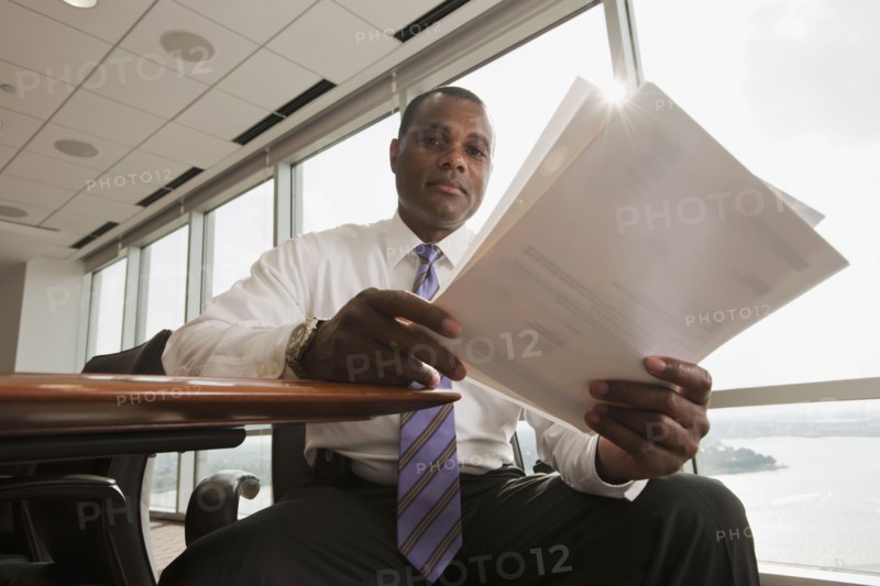 African American businessman reviewing paperwork