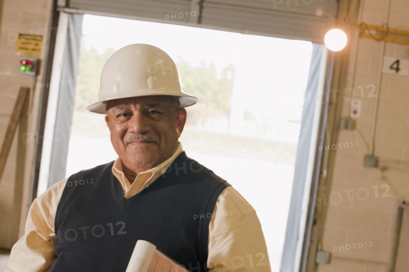 Mixed race man in hard-hat in warehouse