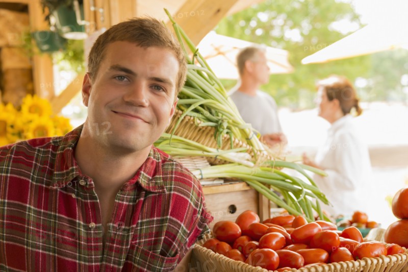 Caucasian man with produce at farmers market