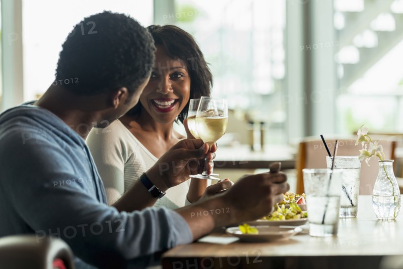 Couple drinking wine at lunch in cafe
