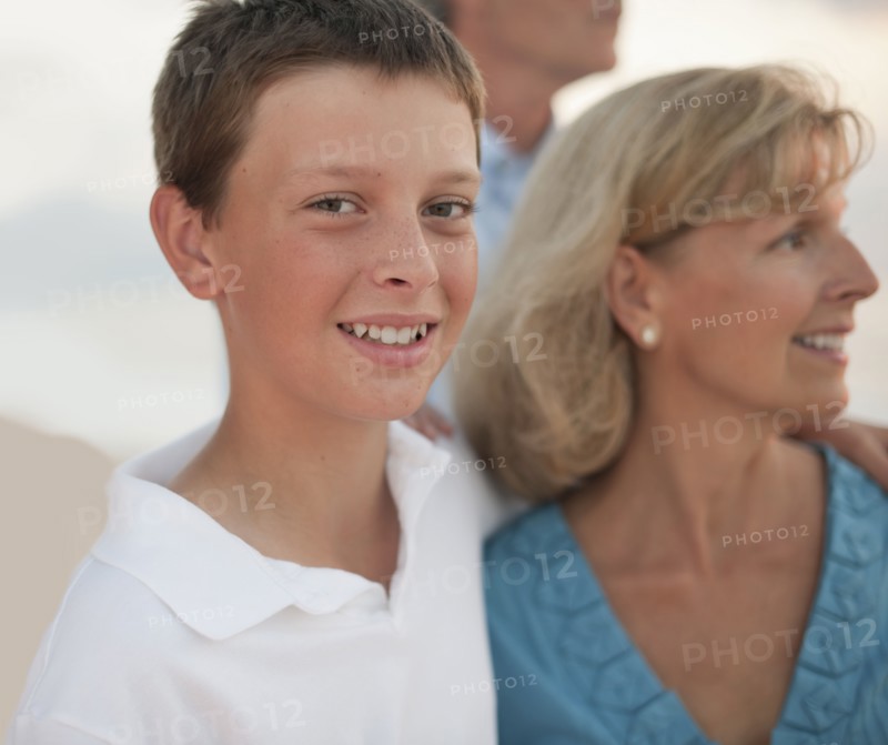 Caucasian family enjoying beach