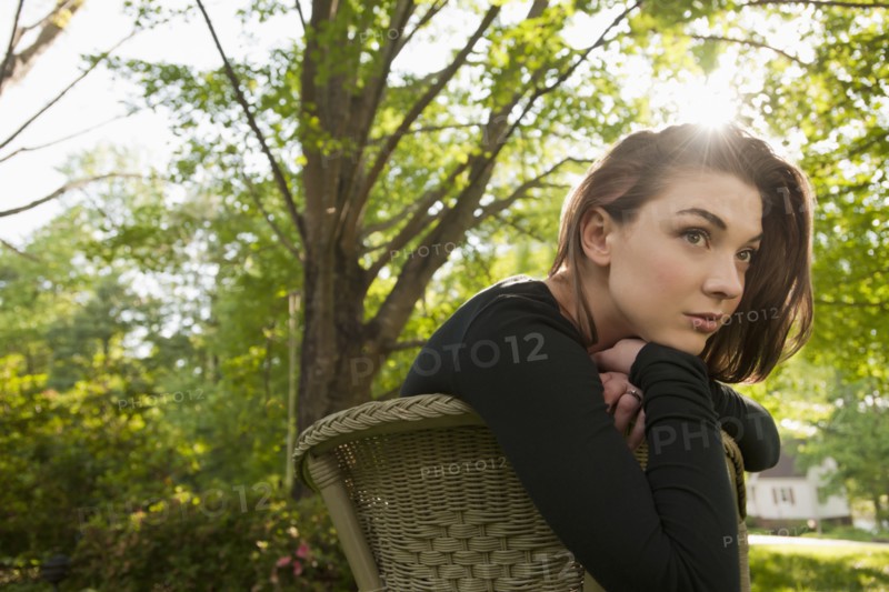 Caucasian woman sitting in chair outdoors
