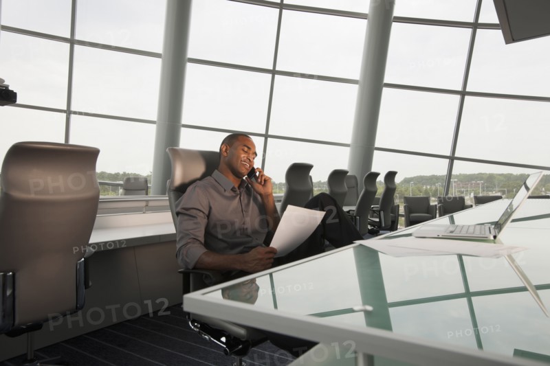 Black businessman working in conference room