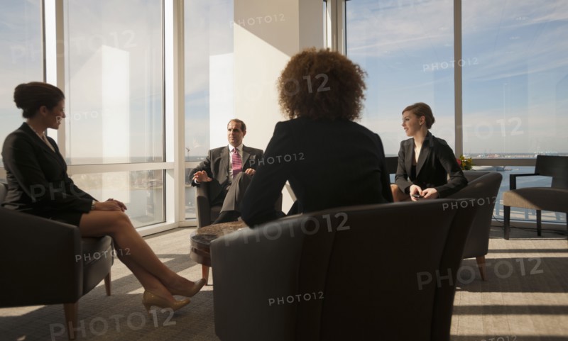 Business people having informal meeting