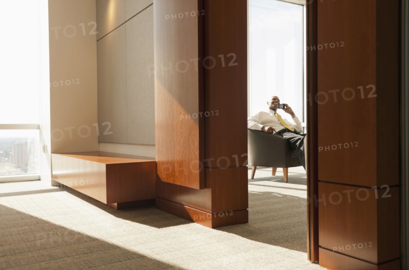 African American businessman talking on cell phone