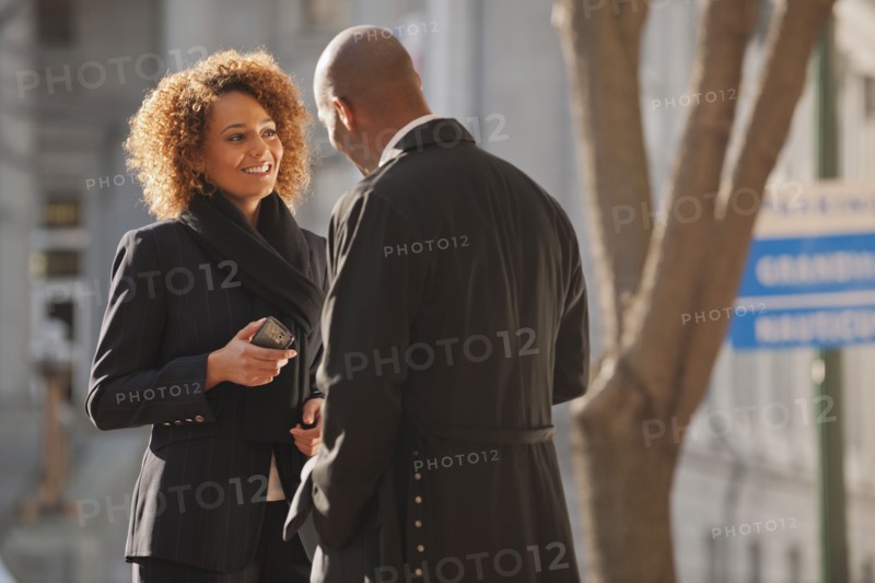 Business people talking together outdoors