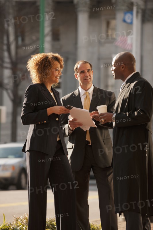 Business people talking together outdoors