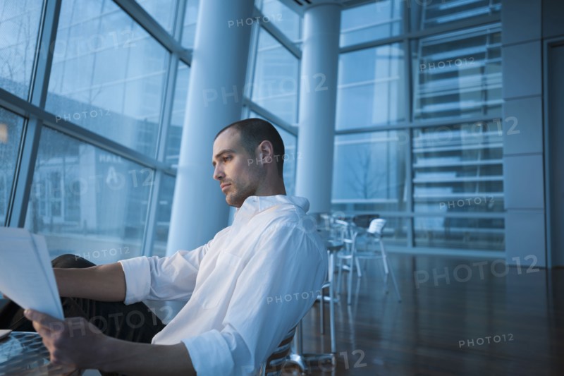 Caucasian businessman looking at paperwork