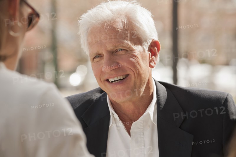 Caucasian couple talking outdoors